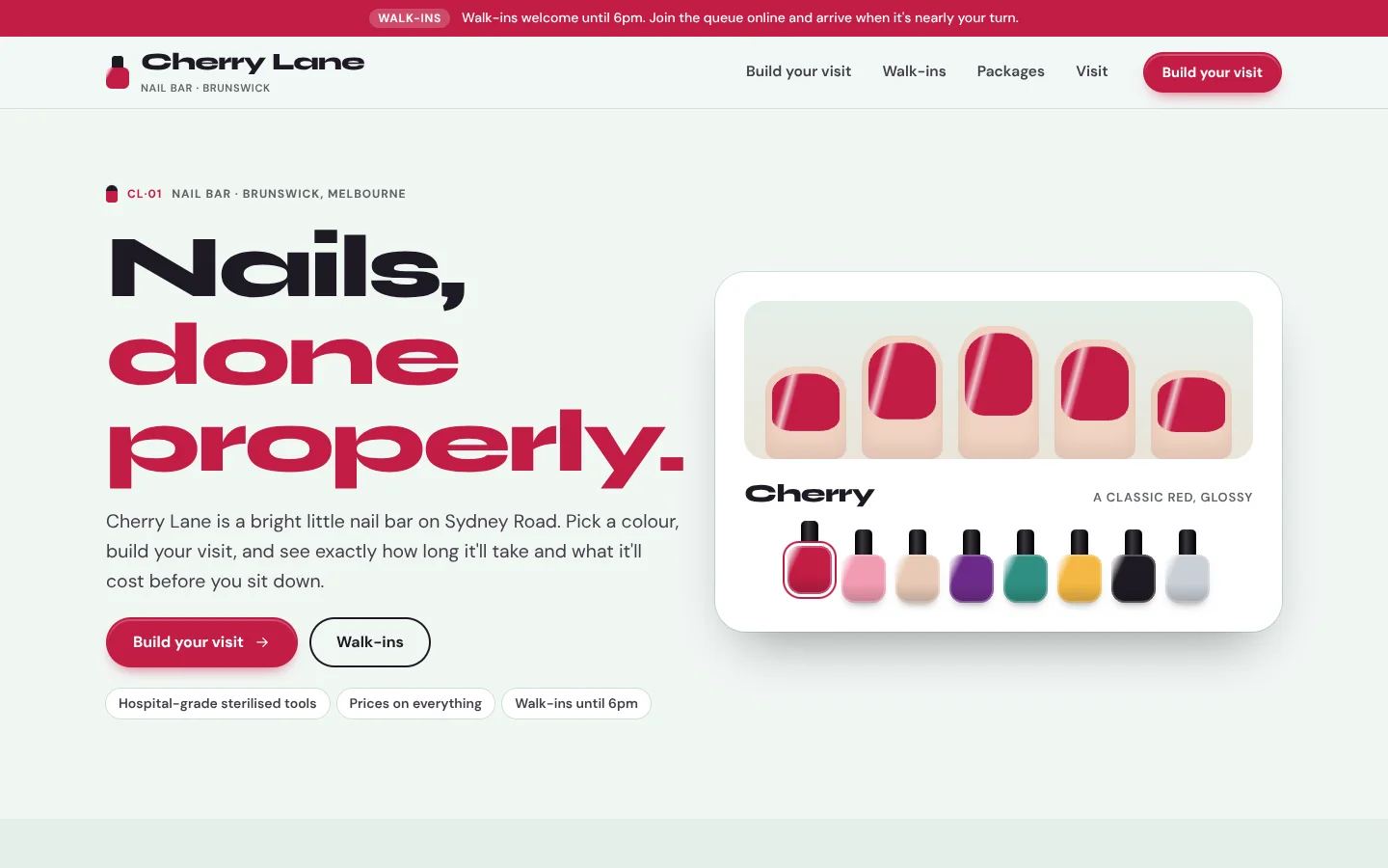 Polish template home page: a wide black and cherry headline beside a white card with five nails painted cherry and a row of eight polish bottles, on mint